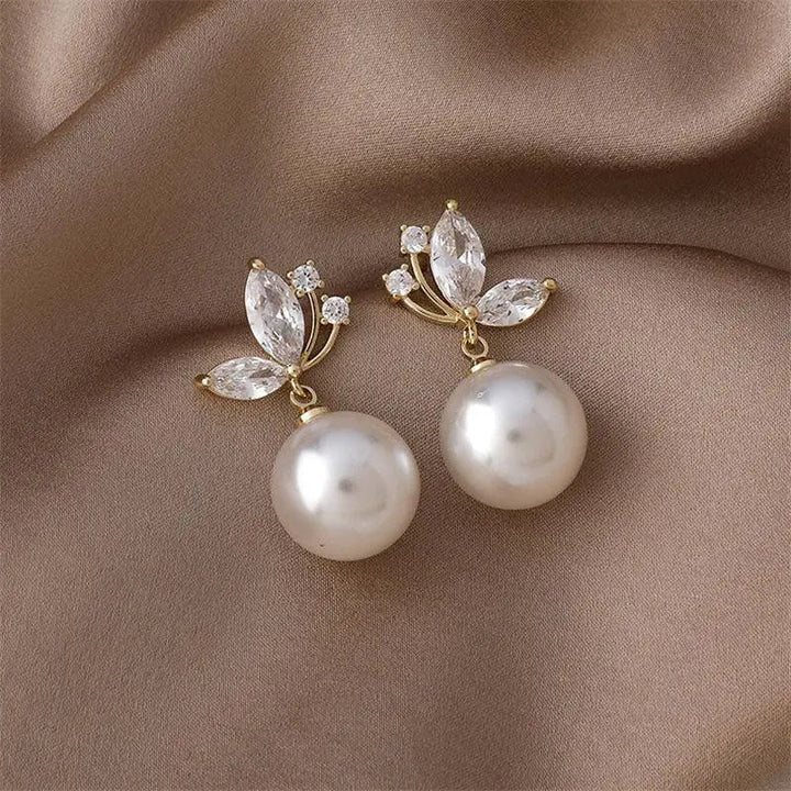 Boucles d’oreilles exotiques aux perles dorées et cristaux